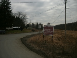 Signage for the churches of Grover, Pennsylvania, located within Canton Township, as seen at a turn from State Route 154 in February 2012